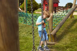 Young boy exploring the outdoor play
