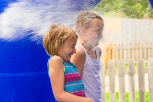 Two girls being sprayed with water at Water Wars